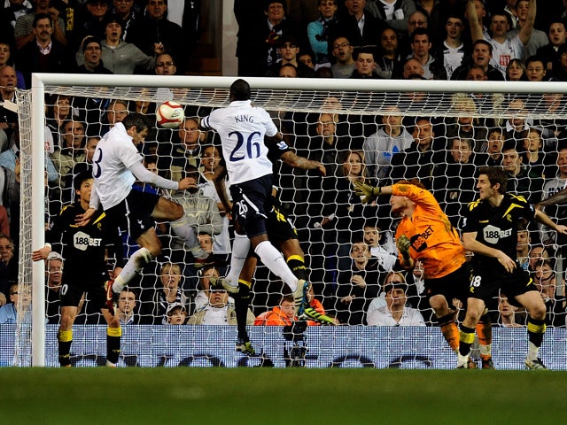 Ryan Nelsen of Spurs scores the opening goal with a header during the FA Cup sixth round match between Tottenham Hotspur and Bolton Wanderers at White Hart Lane on March 27, 2012