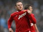 Wayne Rooney celebrates scoring against Manchester City on January 08, 2012.