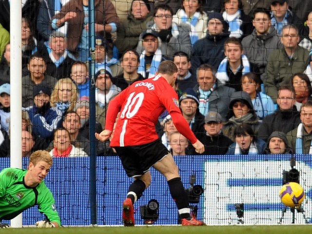 Wayne Rooney scores for Manchester United against Manchester on November 30, 2008.