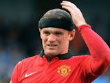 Wayne Rooney looks dejected against Manchester City on September 22, 2013.
