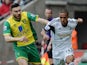 Wayne Routledge of Swansea City is closed down by Robert Snodgrass of Norwich City during the Barclays Premier League match on March 29, 2014