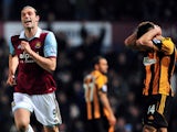 West Ham United's English striker Andy Carroll celebrates celebrates scoring his team's second goal during the English Premier League football match between West Ham United and Hull City at the Boleyn Ground, Upton Park, in East London, England, on March 