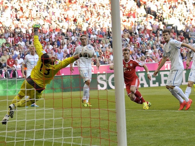 Bayern Munich's Swiss midfielder Xherdan Shaqiri (C) scores the second goal for his team during the German first division Bundesliga football match  on March 29, 2014
