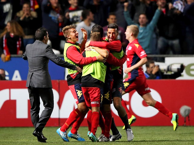 United players celebrate during the round 26 A-League match between Adelaide United and Melbourne Heart at Coopers Stadium on April 4, 2014