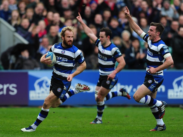 Nick Adendanon of Bath runs in for his side's second try as his team mates celebrate during the Amlin Challenge Cup quarter final match between Bath and Brive at the Recreation Ground on April 6, 2014