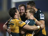 Ben Foden (L) of Northampton celebrates with team mates after scoring a try during the Amlin Challenge Cup quarter final match against Sale Sharks on April 3, 2014