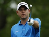 Bill Haas of the United States points on the ninth tee box during round one of the Shell Houston Open at the Golf Club of Houston on April 3, 2014
