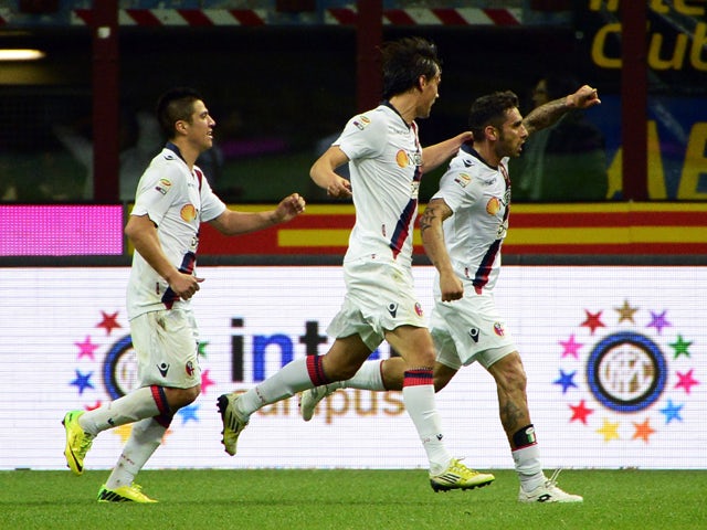Bologna's midfielder Michele Pazienza celebrtaes after scoring during the Italian Serie A football match Inter Milan vs Bologna on April 5, 2014