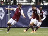 Marc Burch #4 and Charles Eloundou #19 celebrate with Jose Marin #6 of the Colorado Rapids who scored two goals against the Vancouver Whitecaps FC during their MLS game April 5, 2014