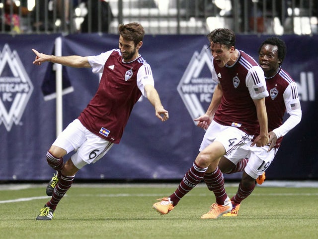 Marc Burch #4 and Charles Eloundou #19 celebrate with Jose Marin #6 of the Colorado Rapids who scored two goals against the Vancouver Whitecaps FC during their MLS game April 5, 2014