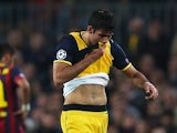 Diego Costa of Club Atletico de Madrid leaves the field injured during the UEFA Champions League Quarter Final first leg match against FC Barcelona on April 1, 2014
