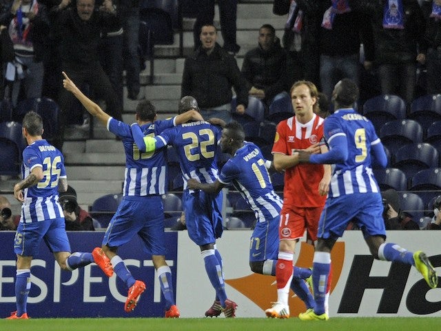 Porto's French defender Eliaquim Mangala (3L) celebrates with teammates after scoring a goal during the UEFA Europa League quarter-finals first leg football match against Sevilla FC on April 3, 2014