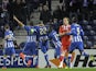 Porto's French defender Eliaquim Mangala (3L) celebrates with teammates after scoring a goal during the UEFA Europa League quarter-finals first leg football match against Sevilla FC on April 3, 2014