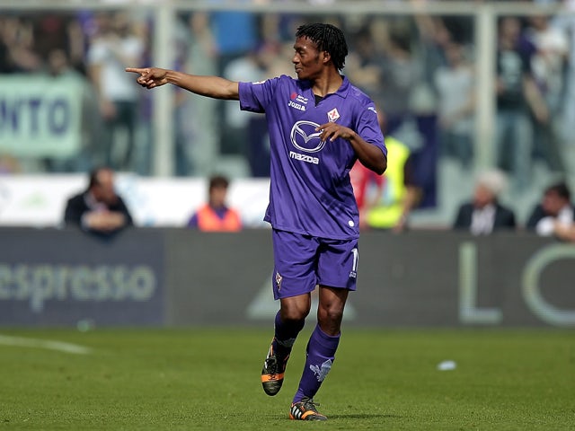 Guillermo Cuadrado of ACF Fiorentina celebrates after scoring a goal during the Serie A match between ACF Fiorentina and Udinese Calcio at Stadio Artemio Franchi on April 6, 2014
