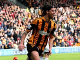 George Boyd of Hull City celebrates after scoring the opening goal with a header during the Barclays Premier league match between Hull City and Swansea City at KC Stadium on April 5, 2014