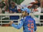 ndia cricketer Virat Kohli reacts after successfully taking a catch to dismiss Sri Lanka batsman Tillakaratne Dilshan during the ICC World Twenty20 cricket tournament final match between India and Sri Lanka in The Sher-e-Bangla National Cricket Stadium in
