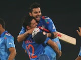 Virat Kohli of India is hugged by Yuvraj Singh after he hit the winning runs as India won the ICC World Twenty20 Bangladesh 2014 2nd Semi-Final match between India and South Africa at Sher-e-Bangla Mirpur Stadium on April 4, 2014