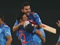 Virat Kohli of India is hugged by Yuvraj Singh after he hit the winning runs as India won the ICC World Twenty20 Bangladesh 2014 2nd Semi-Final match between India and South Africa at Sher-e-Bangla Mirpur Stadium on April 4, 2014