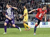 Lille's French forward Nolan Roux celebrates after scoring a goal during the French L1 football match Toulouse vs Lille on April 05, 2014