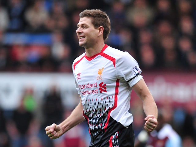 Liverpool's English midfielder Steven Gerrard celebrates after scoring the opening goal from a penalty during the English Premier League football match between West Ham United and Liverpool at Upton Park in London on April 6, 2014