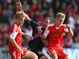 Marouane Chamakh of Crystal Palace battles for the ball with Luke Shaw (L) and James Ward-Prowse (R) of Southampton during a game on September 24, 2013