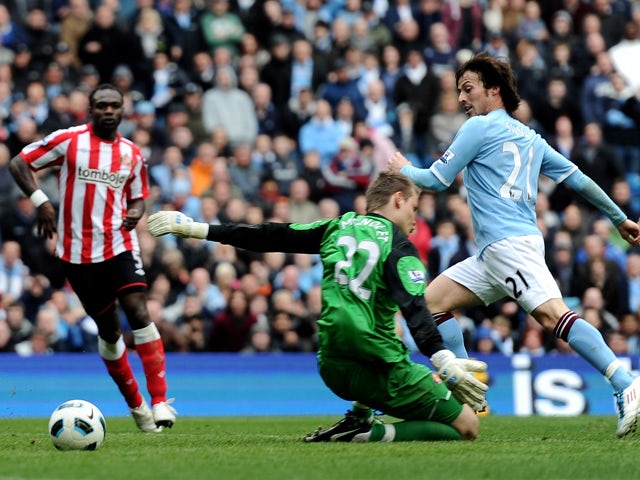David Silva of Manchester City scores his team's third goal during the Barclays Premier League match between Manchester City and Sunderland at the City of Manchester Stadium on April 3, 2011