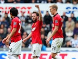 Juan Mata of Manchester United celebrates scoring the opening goal during the Barclays Premier League match between Newcastle United and Manchester United at St James' Park on April 5, 2014