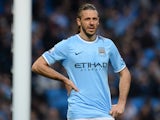 Manchester City's Argentinian defender Martin Demichelis reacts during the English FA Cup quarter-final football match between Manchester City and Wigan Athletic at the Etihad Stadium in Manchester, northwest England, on March 9, 2014