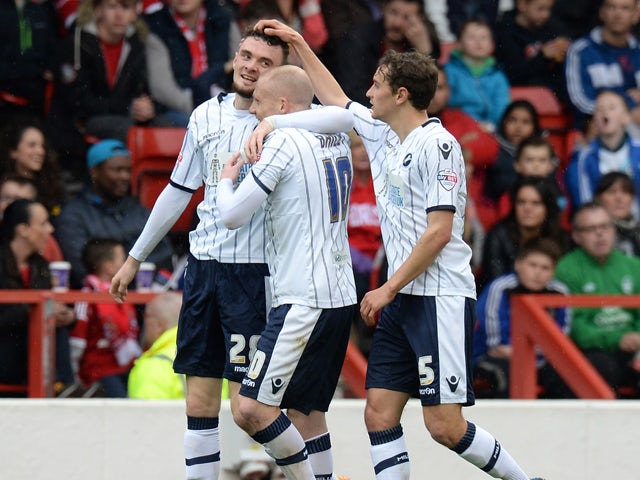 Scott Malone of Millwall celebrates scoring their first goal during the Sky Bet Championship match between Nottingham Forest and Millwall at City Ground on April 05, 2014