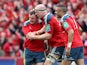 Paul O'Connell of Munster is congratulated by Dave Kilcoyne (left) and Simon Zebo after scoring the last try for Munster during the Heineken Cup Quarter Final match between Munster and Toulouse at Thomond Park on April 5, 2014