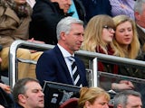 Alan Pardew manager of Newcastle United looks on fromthge stands during the Barclays Premier League match between Newcastle United and Manchester United at St James' Park on April 5, 2014