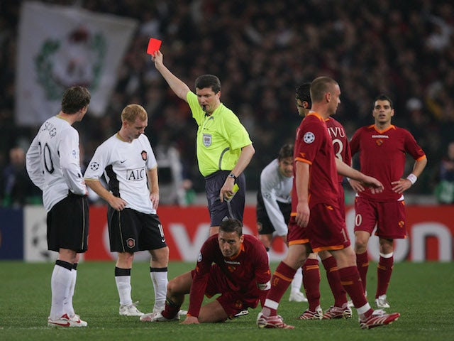 Paul Scholes of Manchester United is sent off by referee Herbert Fandel during the UEFA Champions League quarter final, first leg match against AS Roma on April 4, 2007