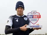 QPR's Ravel Morrison with his March Player of the Month award on April 3, 2014