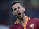 AS Roma's Bosnian midfielder Miralem Pjanic celebrates after scoring against Parma during the Serie A football match between AS Roma and Parma in Rome's Olympic Stadium on April 2, 2014