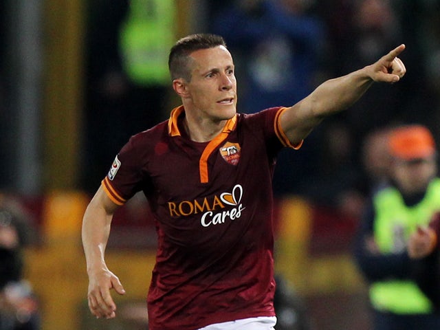 Rodrigo Taddei of AS Roma celebrates after scoring the fourth team's goal during the Serie A match between AS Roma and FC Parma at Olimpico Stadium on April 2, 2014