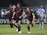 Edinburgh Rugby's Sean Cox and team-mates celebrate their victory after deafeating Racing Metro 92 during their European Cup rugby union match at the Yves du Manoir Stadium in Colombes, northwest of Paris, on January 13, 2012