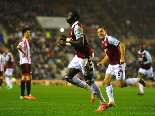 Mohamed Diame of West Ham celebrates with teammate Mark Noble after scoring his team's second goal during the Barclays Premier League match between Sunderland and West Ham United at the Stadium of Light on March 31, 2014