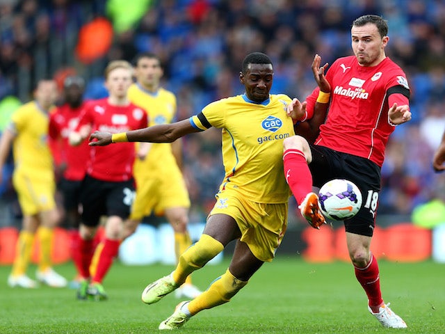 Yannick Bolasie of Crystal Palace and Jordon Mutch of Cardiff compete for the ball during the Barclays Premier League match on April 5, 2014