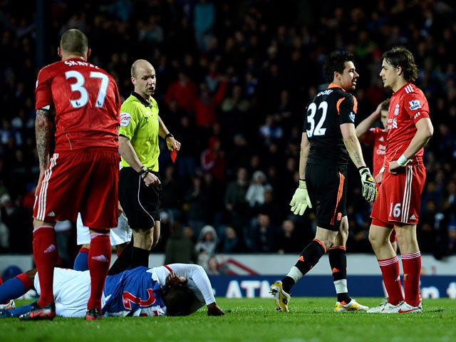 Liverpool goalkeeper Alexander Doni is sent off after fouling Blackburn's Junior Hoilett to concede a penalty in the Premier League match on April 10, 2012