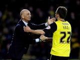 Almen Abdi of Watford celebrates with his manager Beppe Sannino after opening the scoring during the Sky Bet Championship match between Watford and Leeds United at Vicarage Road on April 8, 2014
