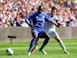 Swansea's Angel Rangel and Chelsea's Demba Ba in actionduring the Premier League match on April 13, 2014