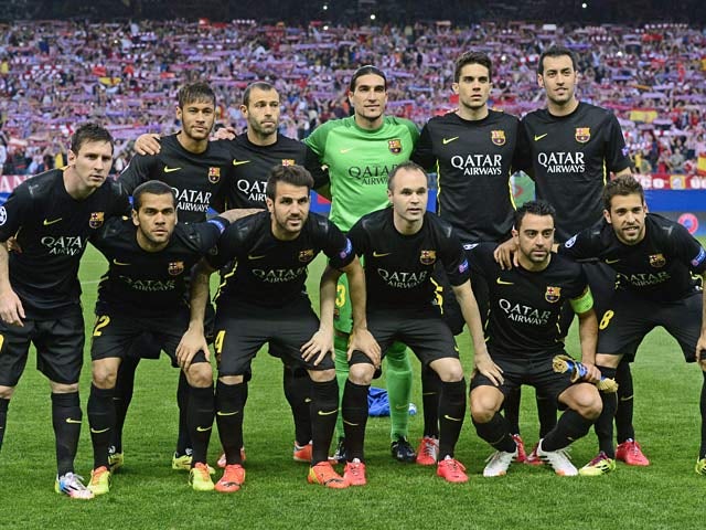 Barcelona players pose for a team photo before kick-off in the Champions League quarter final match against Atletico Madrid on April 9, 2014