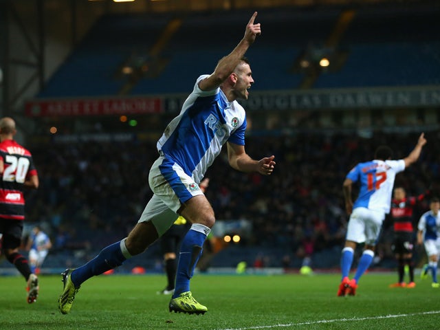 Tommy Spurr of Blackburn Rovers celebrates after scoring the second goal during the Sky Bet Championship match between Blackburn Rovers and Queens Park Rangers at Ewood Park on April 08, 2014