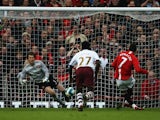 Manchester United's Cristiano Ronaldo scores the opening goal via the penalty spot against Arsenal during the Premier League match on April 13, 2008