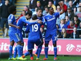 Chelsea's Demba Ba is congratulated by team mates after scoring the opening goal against Swansea during the Premier League match on April 13, 2014