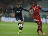 Bayern Munich's Jerome Boateng and Manchester United's Wayne Rooney in action during their Champions League quarter final match on April 9, 2014