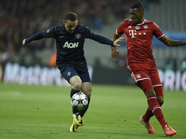 Bayern Munich's Jerome Boateng and Manchester United's Wayne Rooney in action during their Champions League quarter final match on April 9, 2014