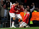 Manchester United's Ji-Sung Park celebrates with teammates after scoring his team's second goal against Chelsea during the Champions League quarter final match on April 12, 2011