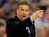 Head coach John Calipari of the Kentucky Wildcats motions to his players during the NCAA Men's Final Four Championship against the Connecticut Huskies at AT&T Stadium on April 7, 2014
