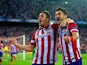Atletico Madrid's Koke celebrates with team mate David Villa after scoring the opening goal against Barcelona during their Champions League quarter final match on April 9, 2014